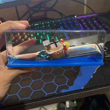 Going Merry and Thousand Sunny floating ship models from One Piece, realistic fluid liquid design, perfect decorative pieces and gifts for fans