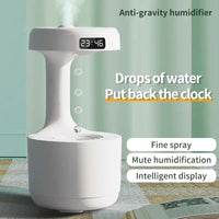 Ultrasonic Water Droplet Air Humidifier with anti-gravity mist technology, LED night light, and sleek design for improving air quality and creating a calming atmosphere.