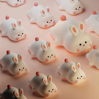 Cute rabbit-shaped silicone night light, soft and touch-sensitive lamp for a cozy bedroom ambiance.