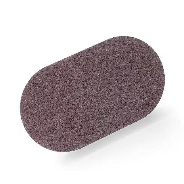 Magic Sponge with ergonomic handle for tough stain, grease, and grime removal, ideal for cleaning countertops, sinks, and tiles with ease and comfort.